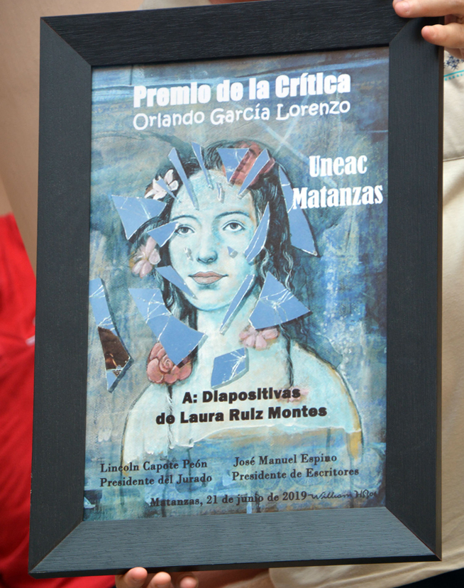 El libro Diapositivas de la poetisa, editora y ensayista Laura Ruiz Montes, trasciende como Premio de la Crítica Orlando García Lorenzo, galardón que otorga la sección de Literatura de la Unión Nacional de Escritores y Artistas de Cuba (UNEAC), en la provincia de Matanzas, el 21 de junio de 2019. El libro Diapositivas de la poetisa, editora y ensayista Laura Ruiz Montes, trasciende como Premio de la Crítica Orlando García Lorenzo, galardón que otorga la sección de Literatura de la Unión Nacional de Escritores y Artistas de Cuba (UNEAC), en la provincia de Matanzas, el 21 de junio de 2019.