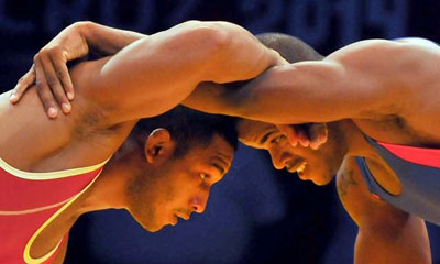 Reineris Salas (D), de los 86 kilogramos, ganador de la medalla de oro en lucha libre, en los XXII Juegos Centroamericanos y del Caribe, en Veracruz, México, el 29 de noviembre de 2014. AIN FOTO ARCHIVO reineris_salas_lucha.jpg