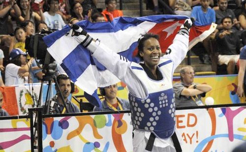 Yania Aguirre de Cuba ( azul ) ganadora de la medalla de oro al derrotar a Itzel Manjarrez de México, en la categoría de los 49 Kg del Taekwondo de los XVII Juegos Panamericanos, en el Centro Deportivo de Mississauga, en Toronto, Canadá, el 19 de julio de 2015. AIN FOTO/ Roberto MOREJON RODRIGUEZ Yania Aguirre de Cuba ( azul ) ganadora de la medalla de oro al derrotar a Itzel Manjarrez de México, en la categoría de los 49 Kg del Taekwondo de los XVII Juegos Panamericanos, en el Centro Deportivo de Mississauga, en Toronto, Canadá, el 19 de julio de 2015. AIN FOTO/ Roberto MOREJON RODRIGUEZ